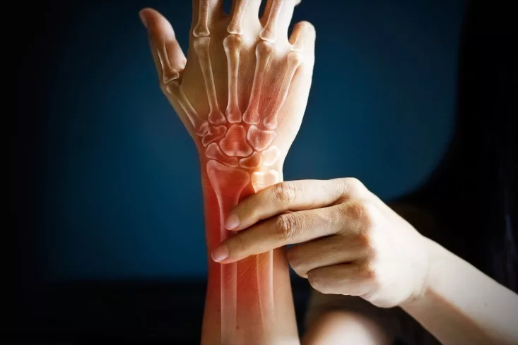 illustration of an injured wrist with red highlighting the injury