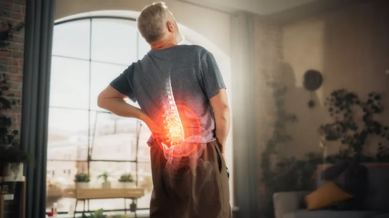 image of a man suffering from arthritis pain in his back