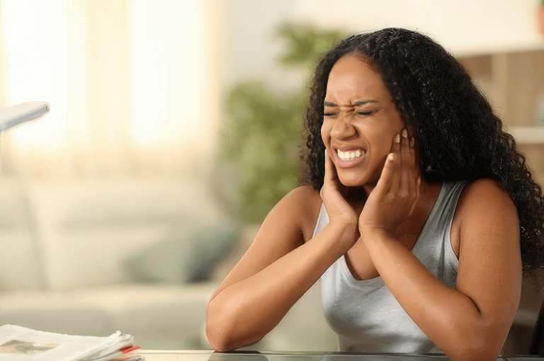 image of a woman suffering from TMJ pain