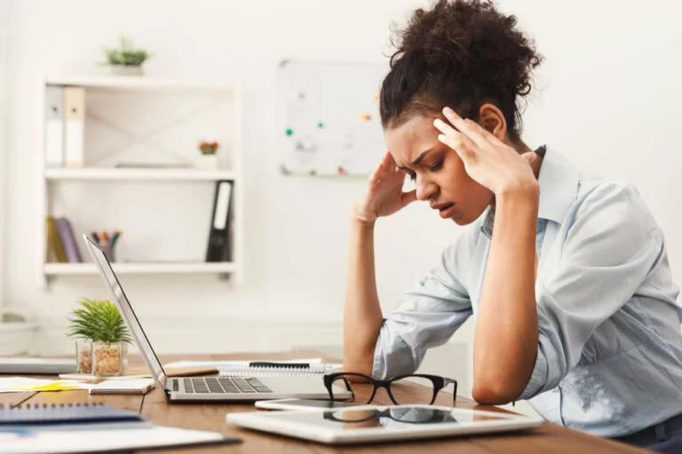 image of a woman suffering from a headache