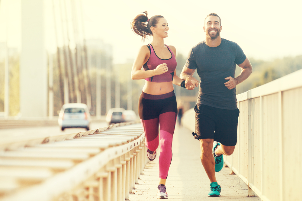 stock image of a couple running and happy